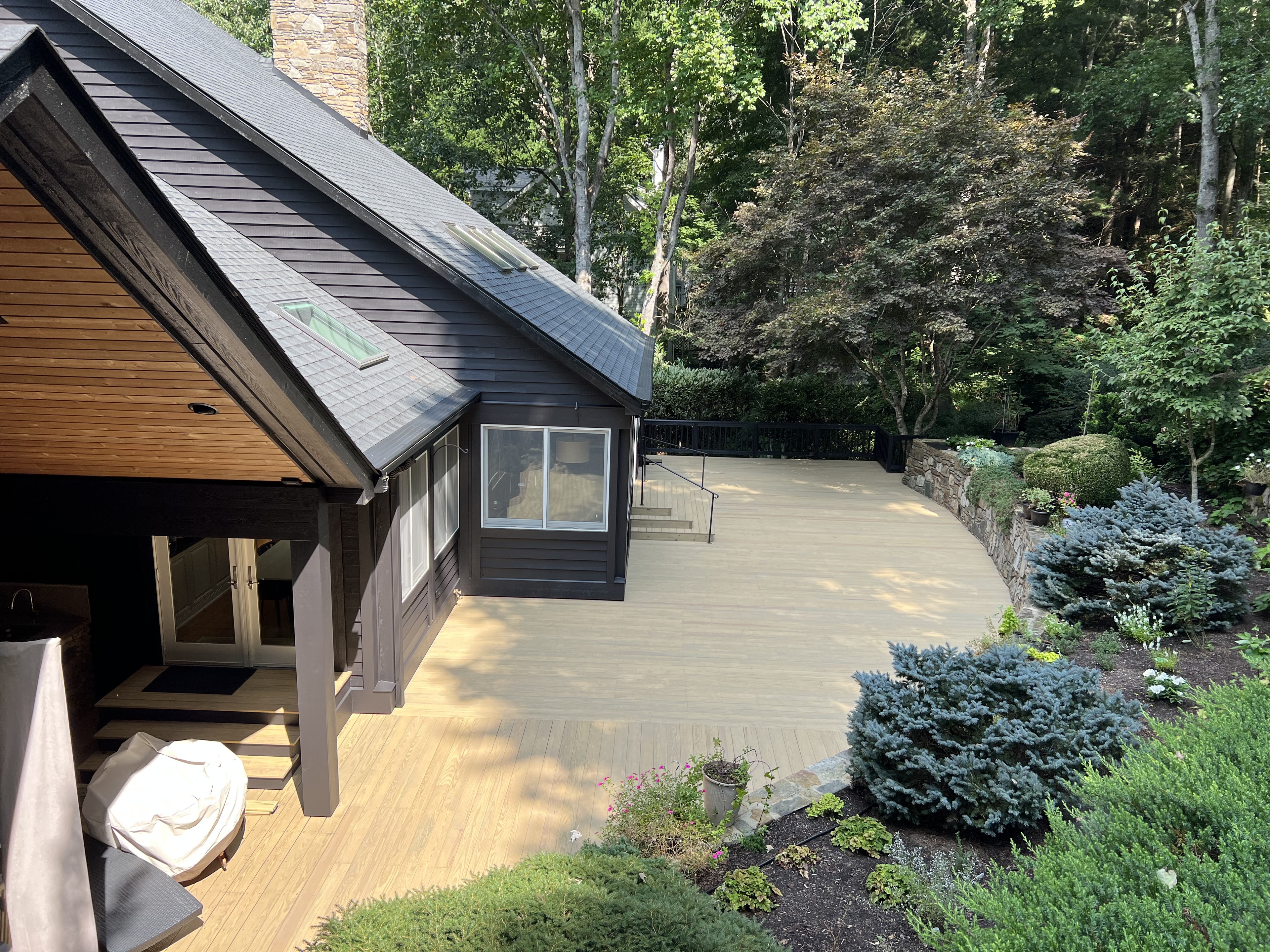 Modern single story home with large white deck
